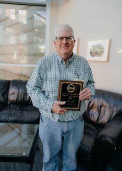 Photo of Andrew Dewey with 2025 MSBA Lifetime Achievement Award
